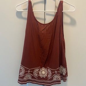 Open tie back tank top. Never worn